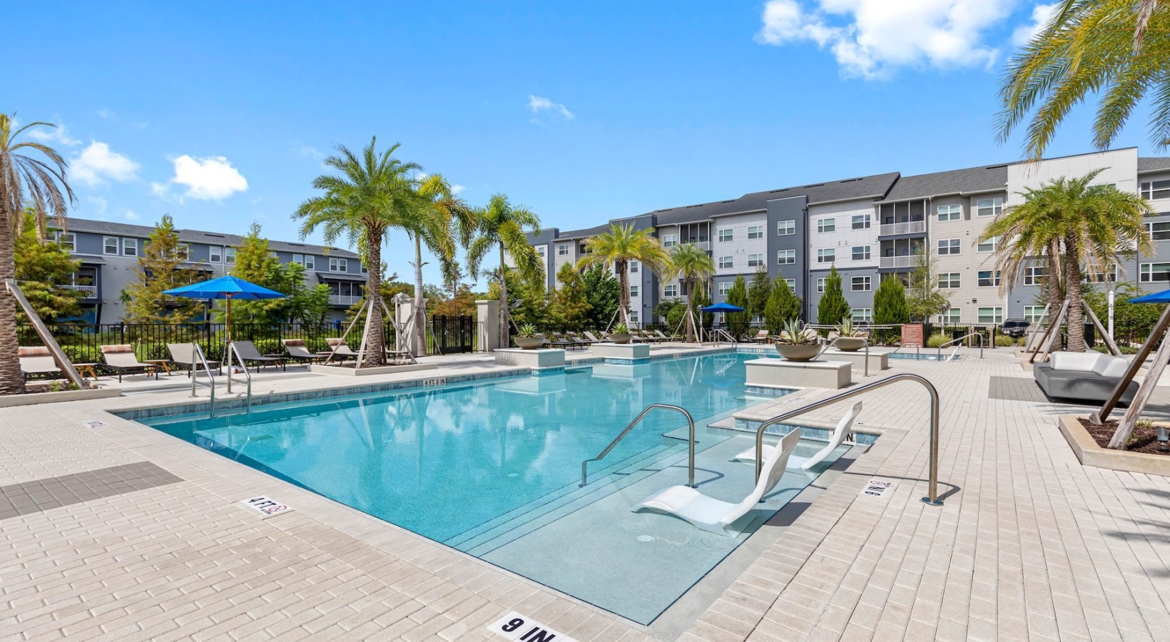 pool with lounge chairs
