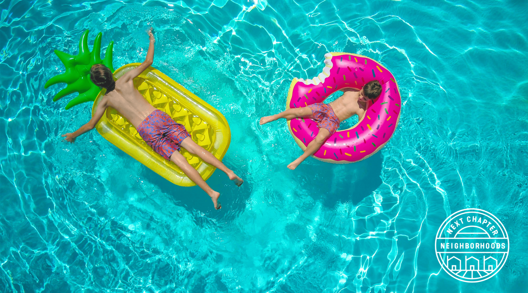 kids in floaties in a pool