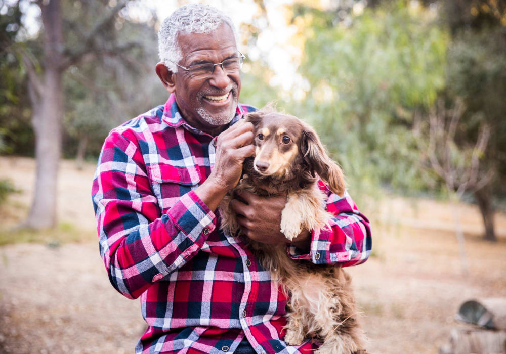 Resident with his dog at Creekside Apartment Homes in Stanwood, Washington