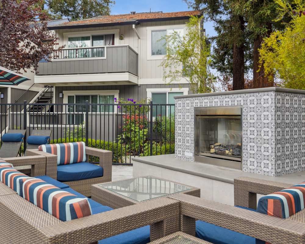 Outdoor lounge with fireplace at Sofi Berryessa in San Jose, California