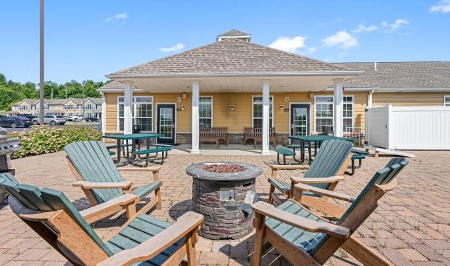 a patio with chairs and tables