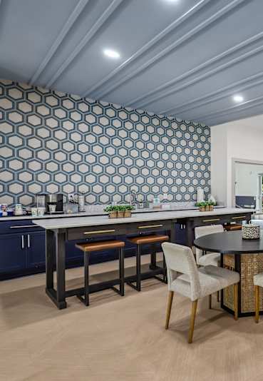 a small kitchen with a sink and a refrigerator