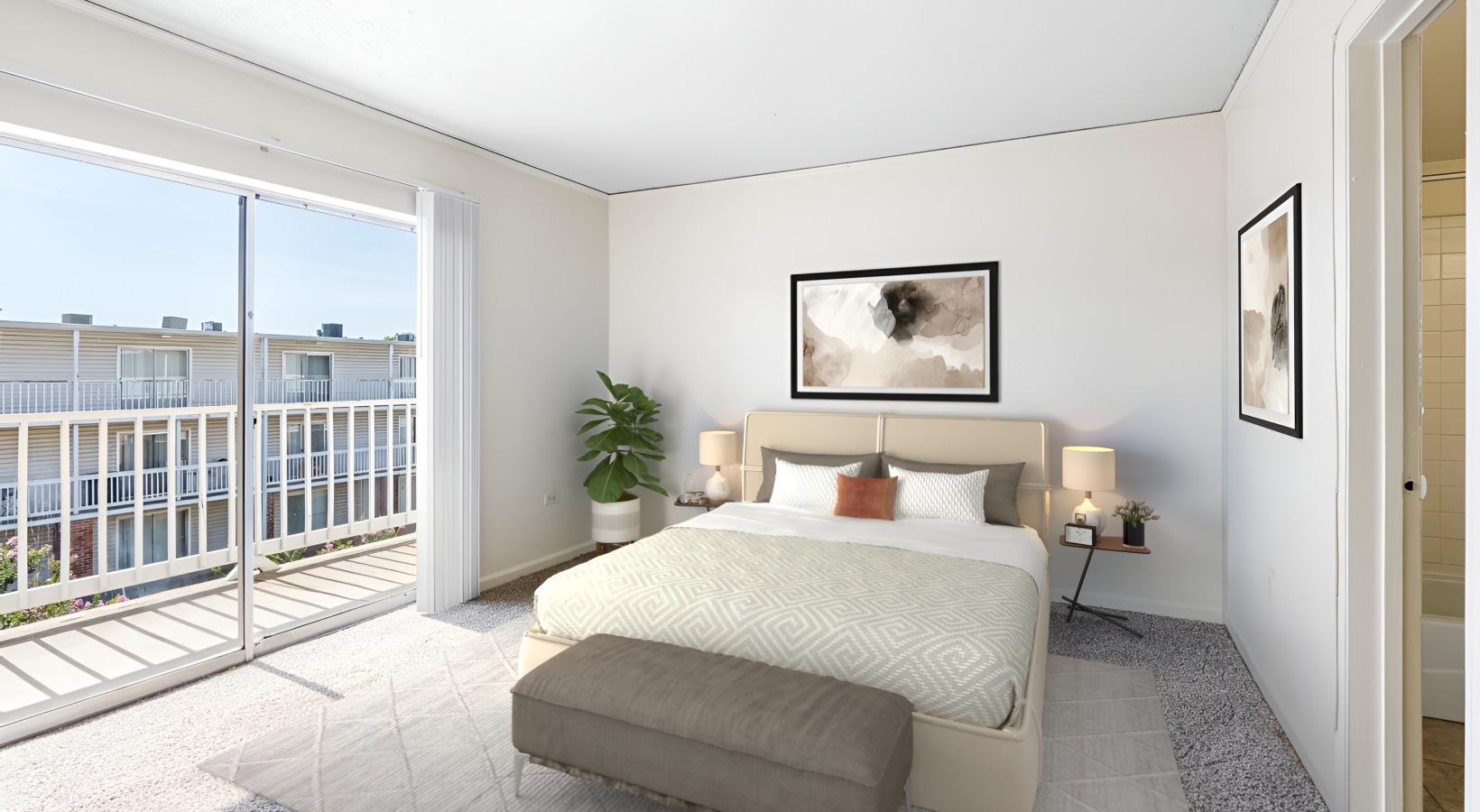 A serene bedroom featuring a large window, teal accents, modern decor, and a cozy upholstered bench at the foot of the bed, all set on a soft carpeted floor.