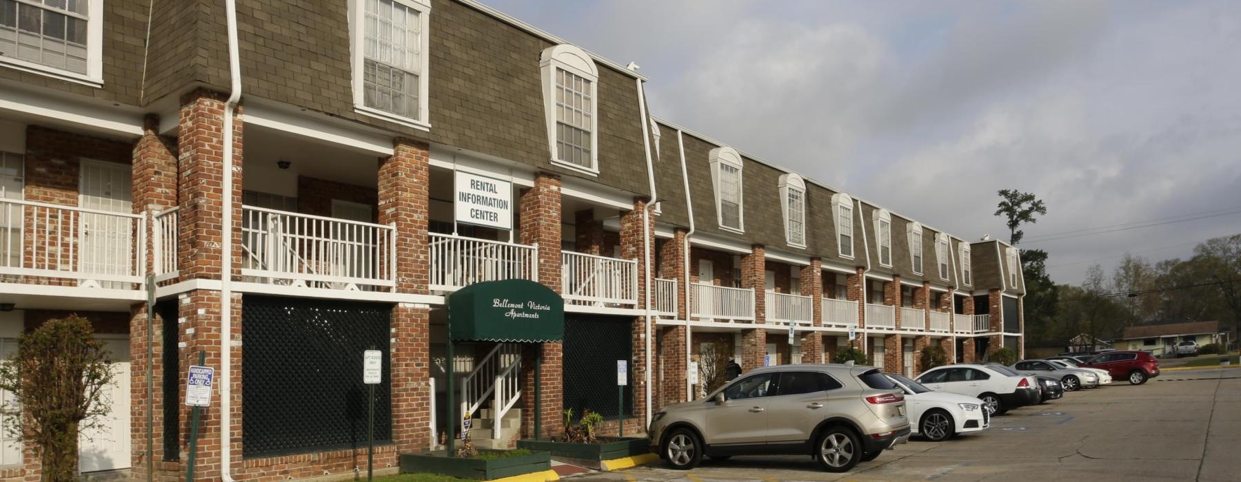 a building with cars parked in front