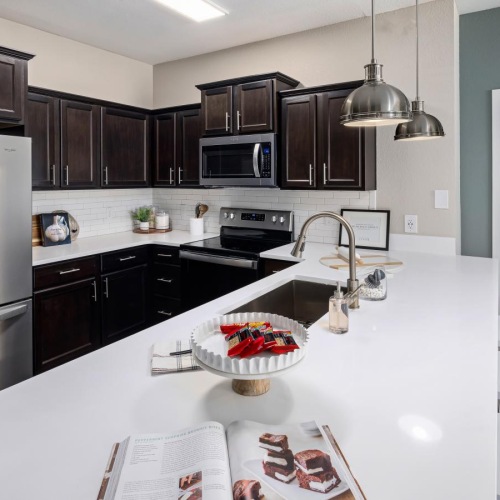 a kitchen with a counter and a refrigerator