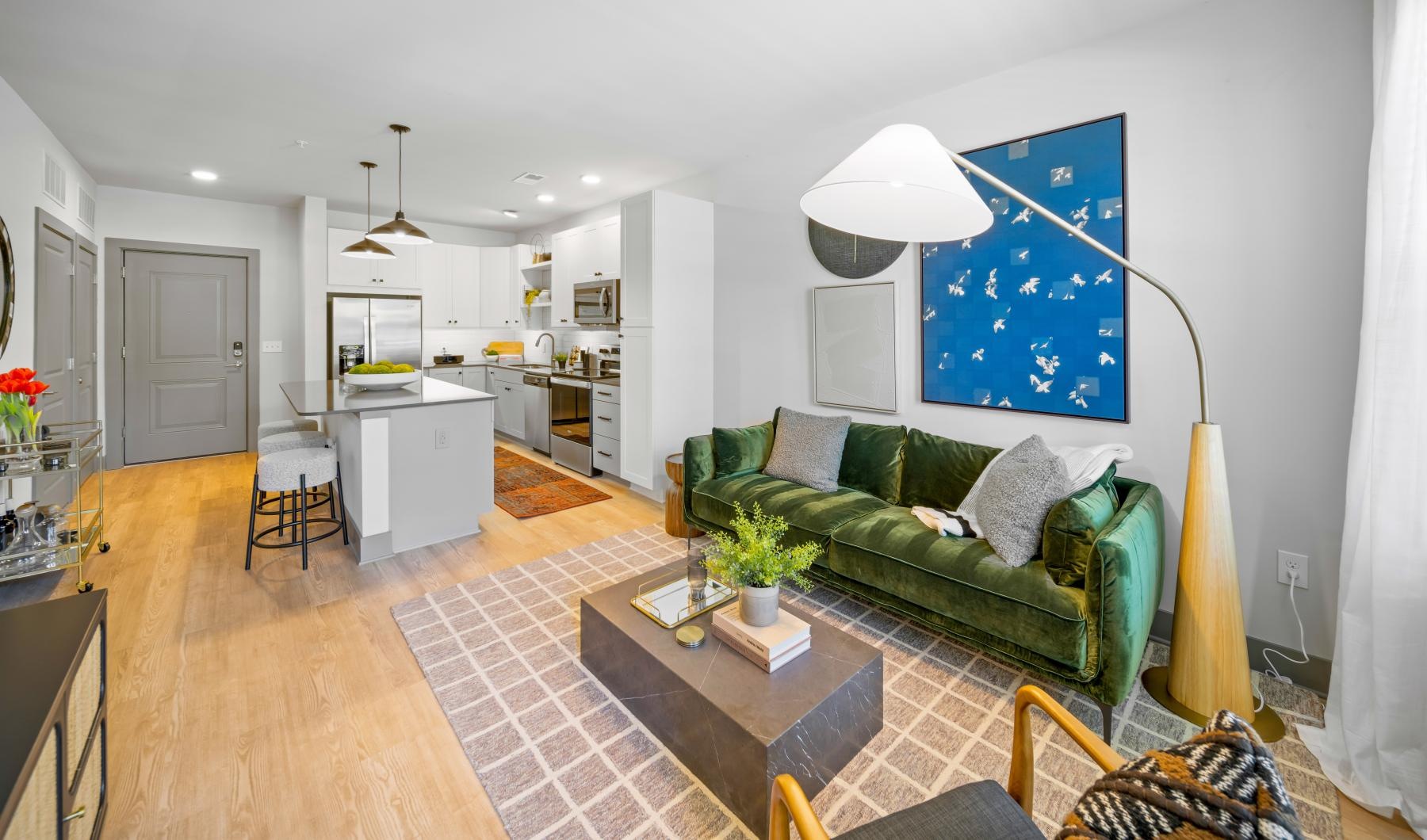 a living room with a green couch