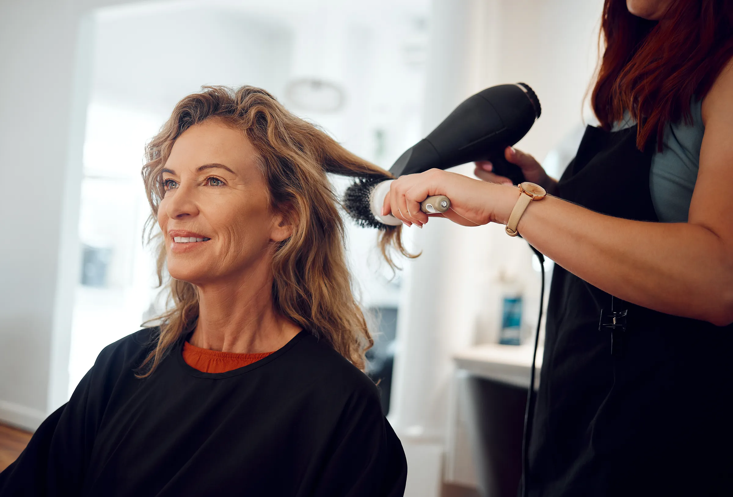 woman in salon having her hair done