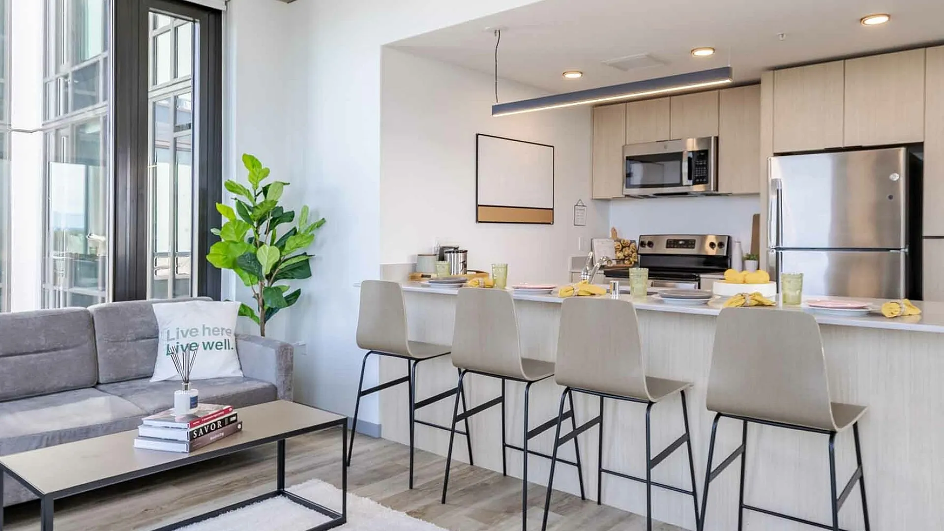 Modern kitchen and living space at The Accolade apartments in Seattle.