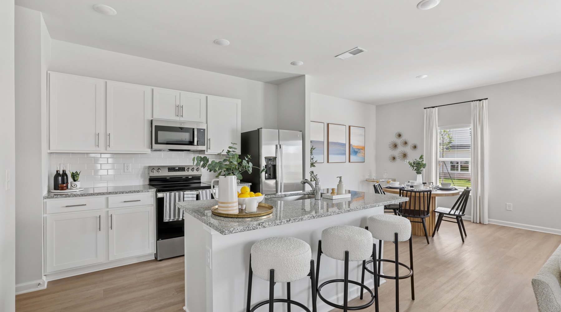 spacious kitchen with granite countertops and stainless steel appliances