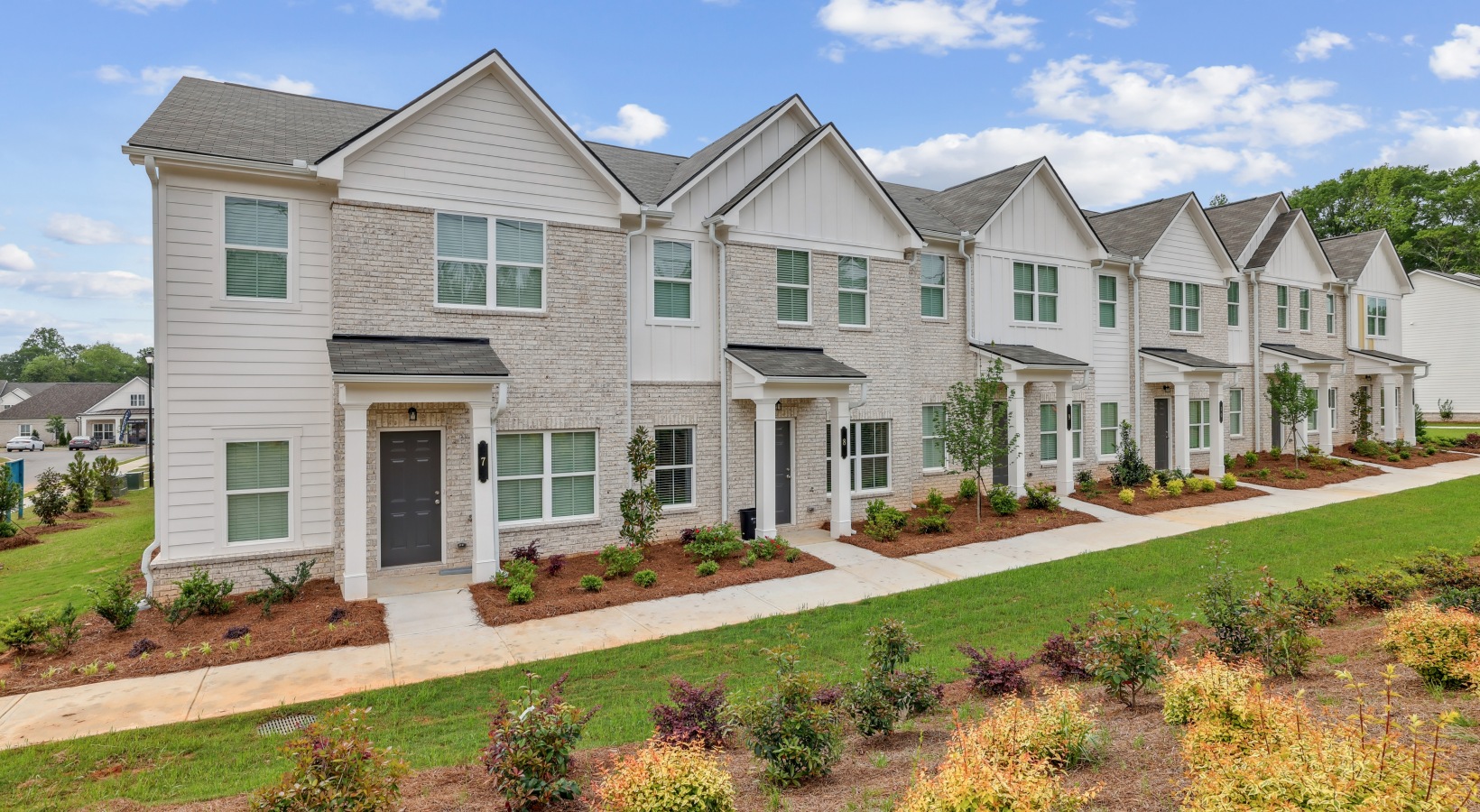 row of towhomes with landscaping