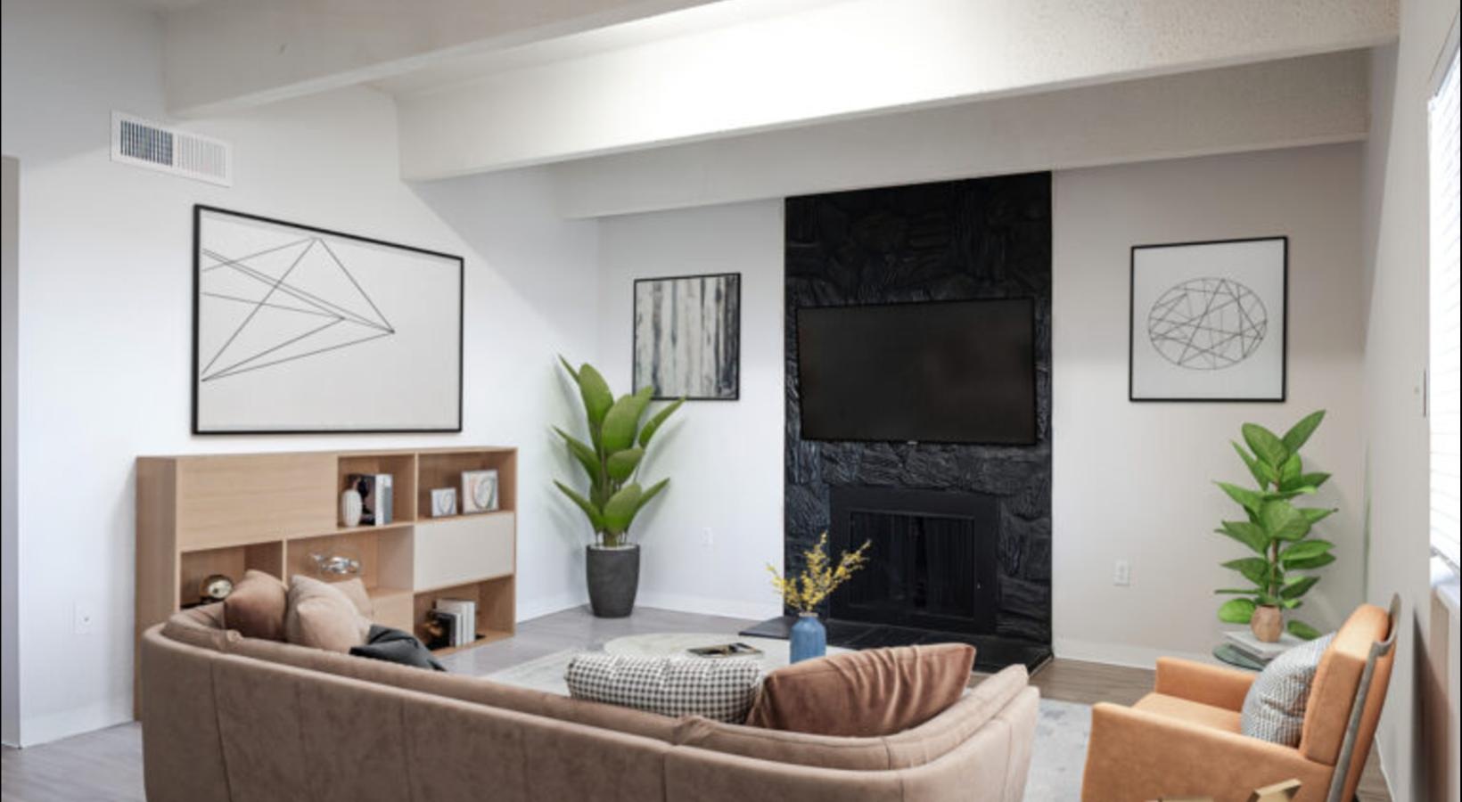 a living room with a fireplace and a couch
