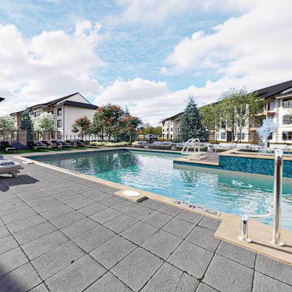 A swimming pool surrounded by apartment buildings.at The Logan Luxury Apartments, Nampa, ID, 83651