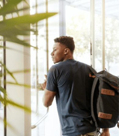 Male student with a backpack. Elle's apartments are nearby George Washington University & other top schools in DC.