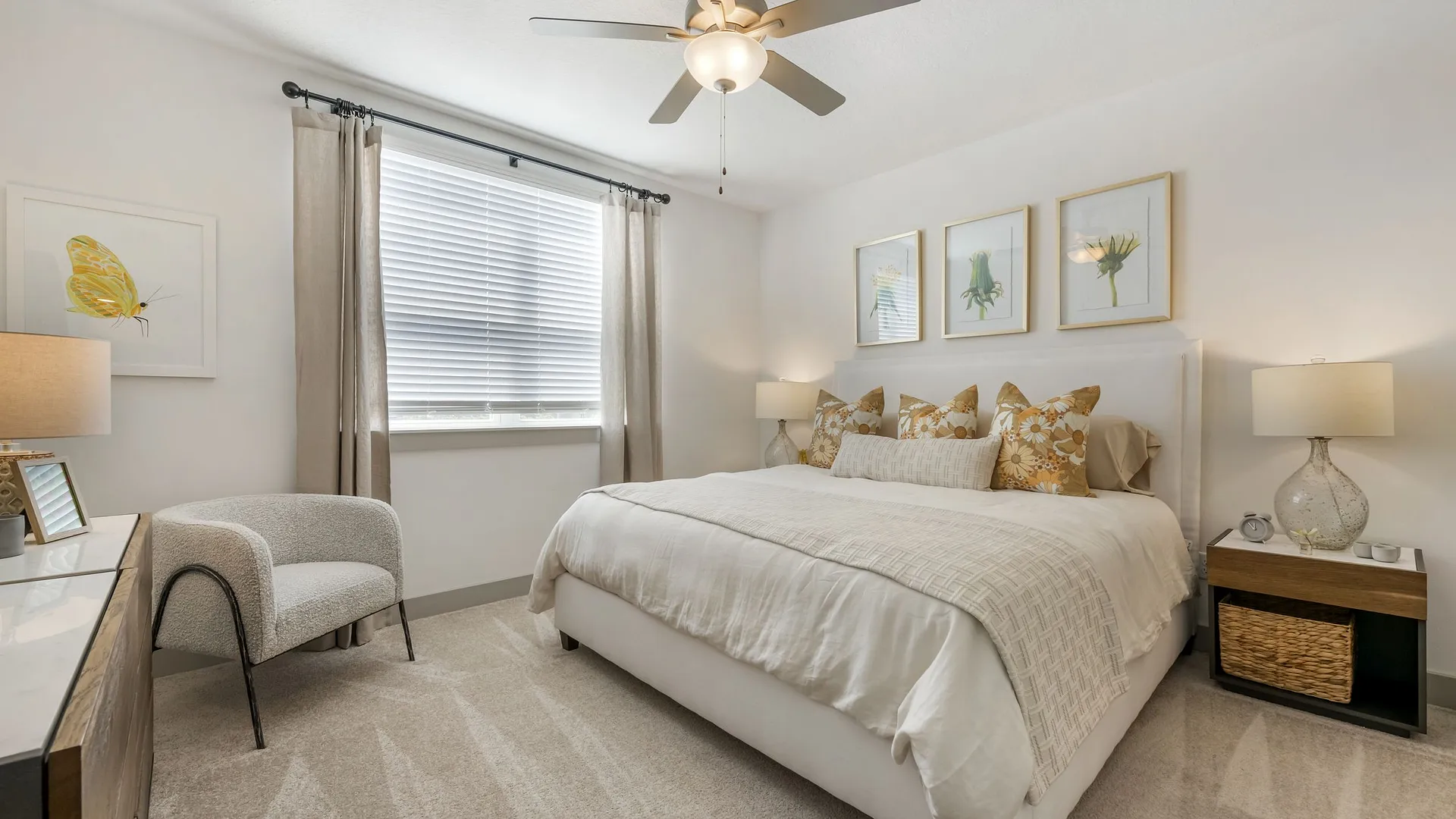 Cozy bedroom with a king-sized bed, soft yellow decor, and modern furnishings.