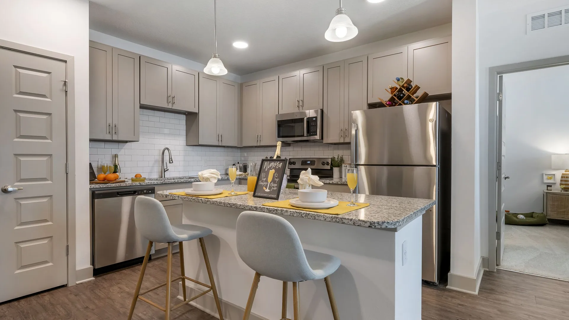 Modern kitchen with gray cabinets and a stylish island setup.
