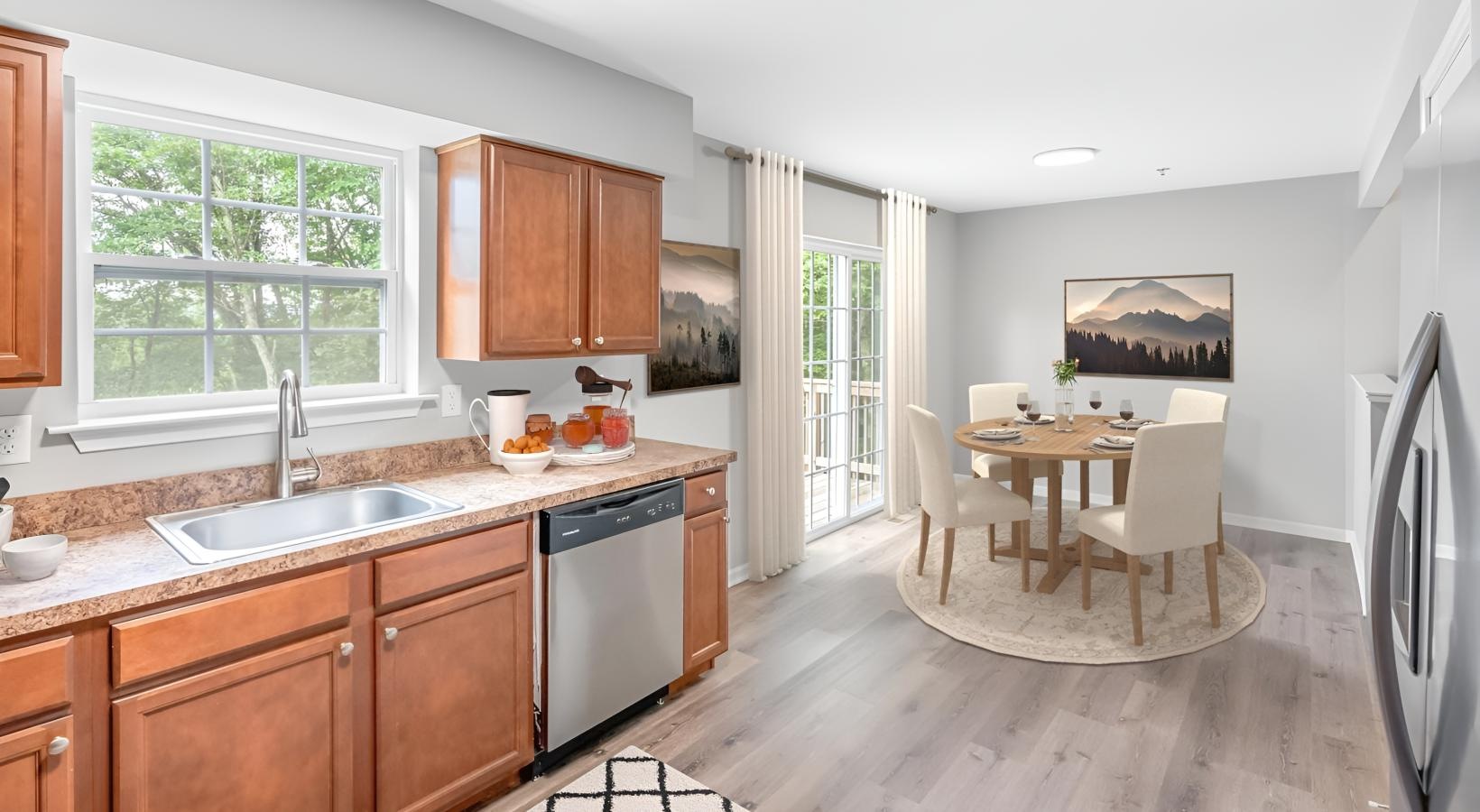 a kitchen with a dining table and a sink