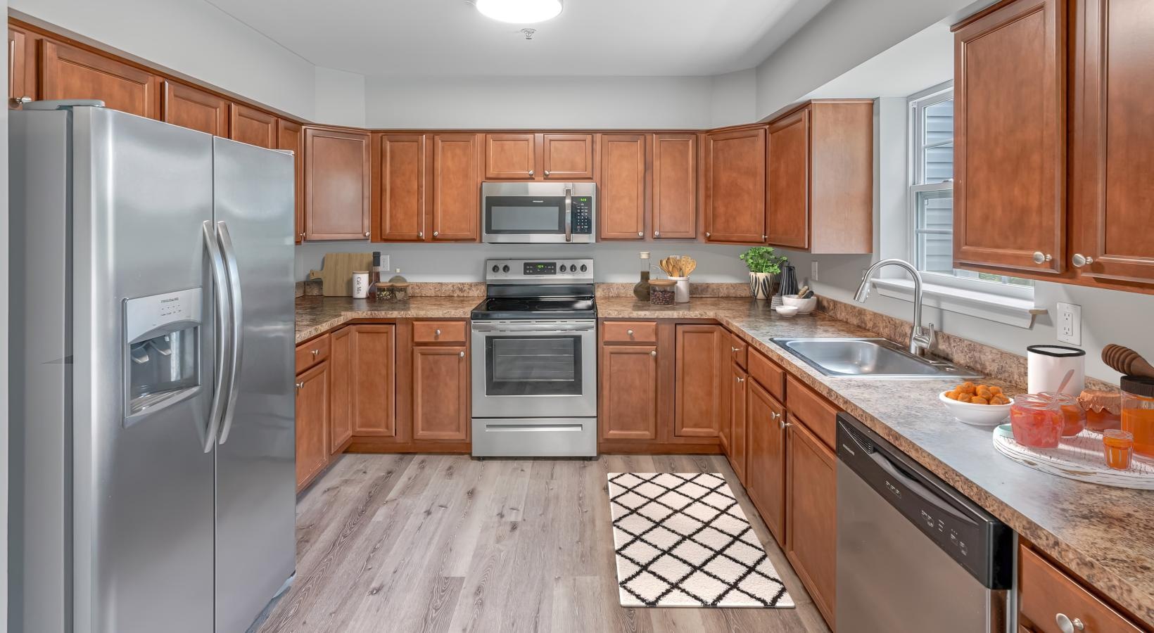a kitchen with wooden cabinets