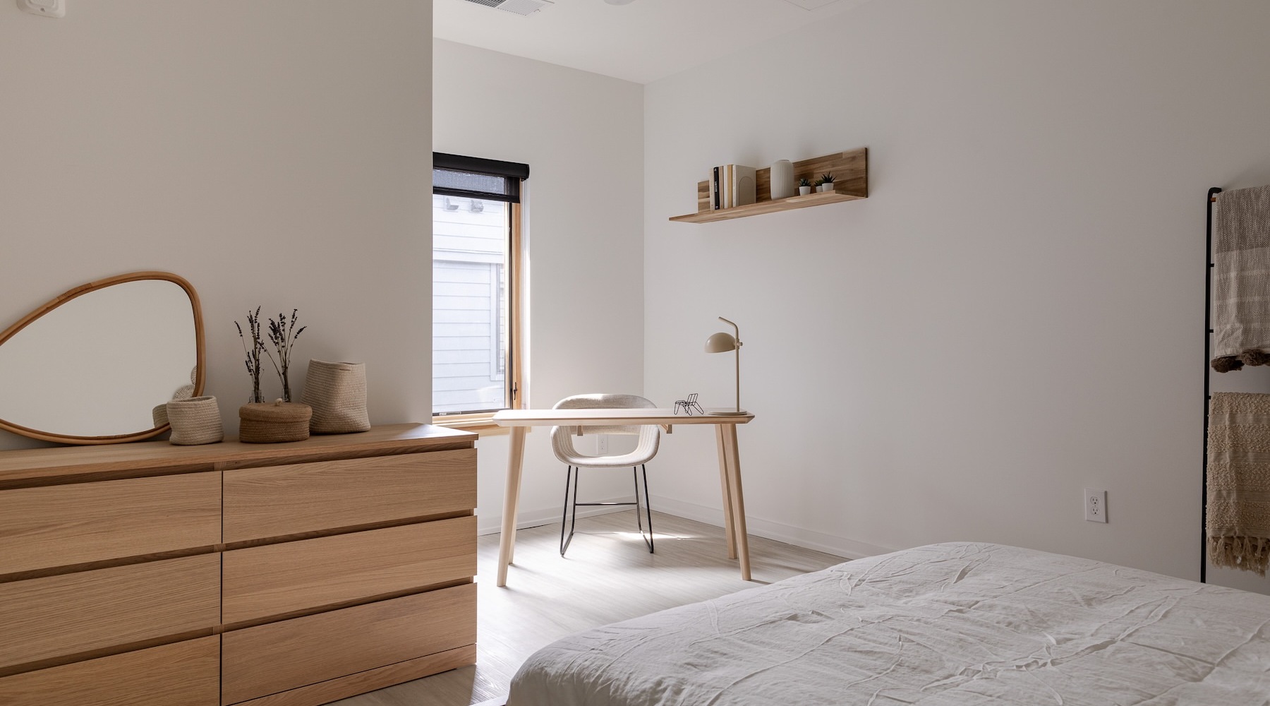 a bedroom with a bed and a desk