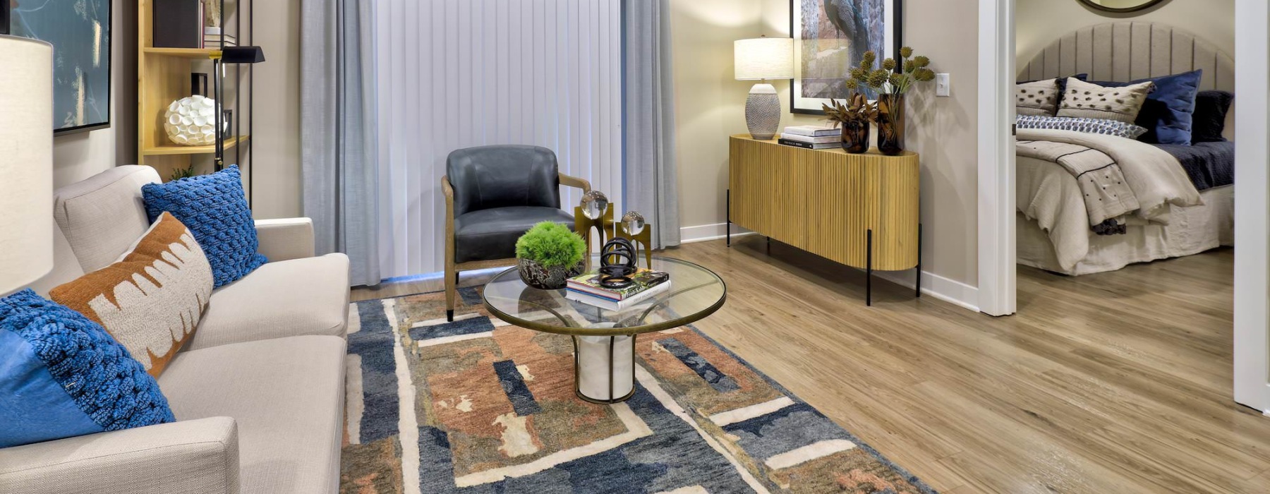 Open space living room leading into a bedroom in our apartments in Charlotte, NC.