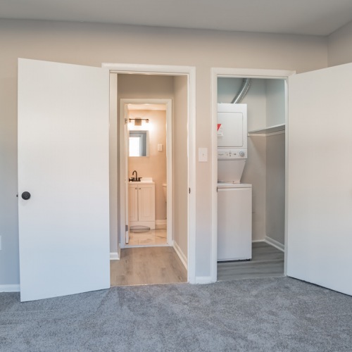 Bedroom with natural lighting in-unit laundry space
