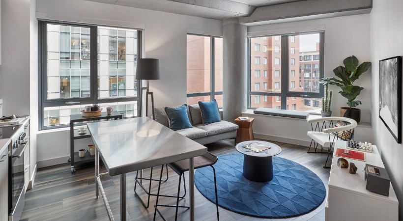 a living room with a couch and tables