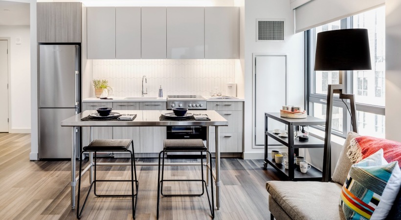 a kitchen with a table and chairs