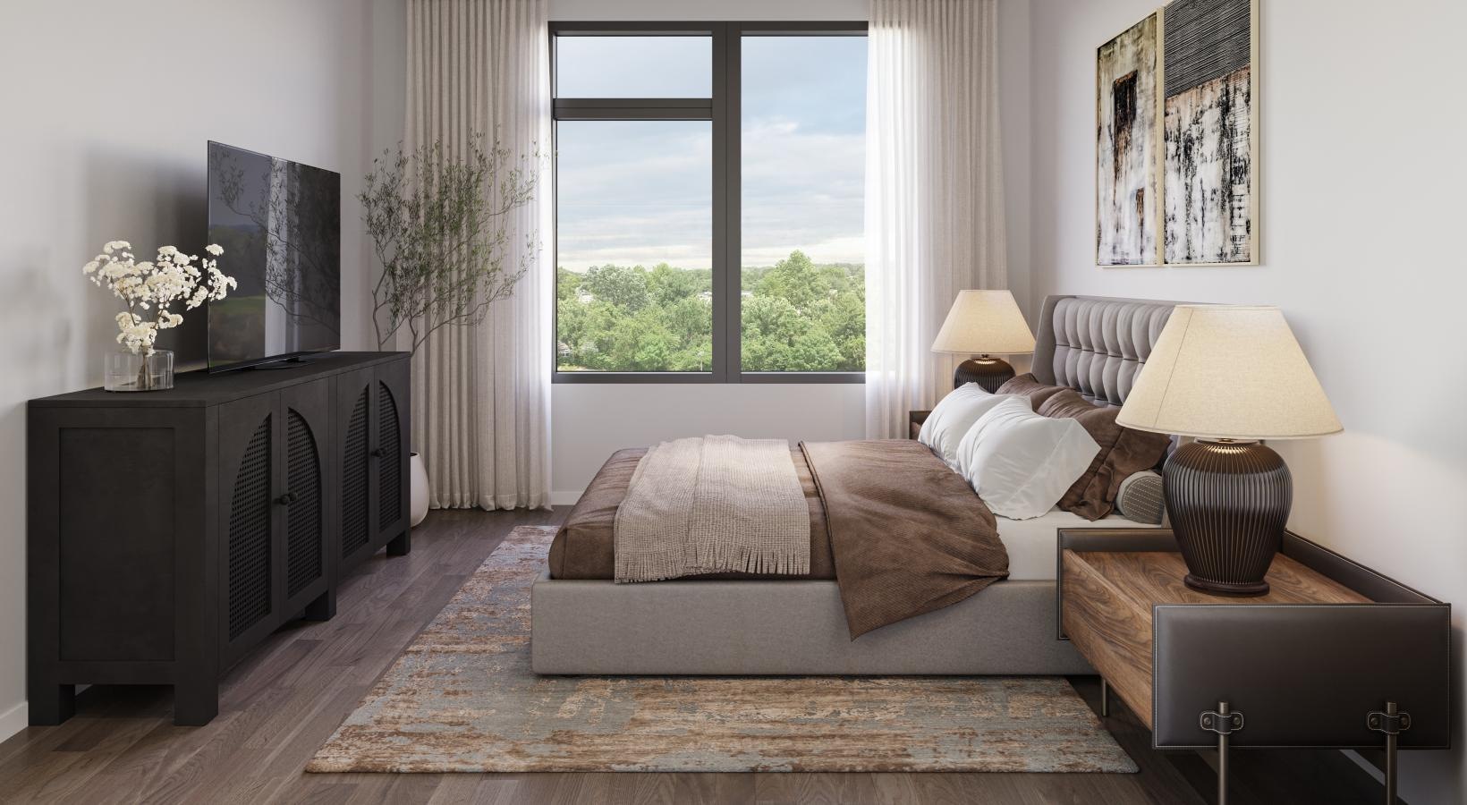 a bedroom with a bed, dresser and a tv