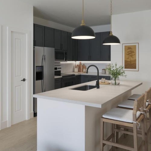 a kitchen with a marble island