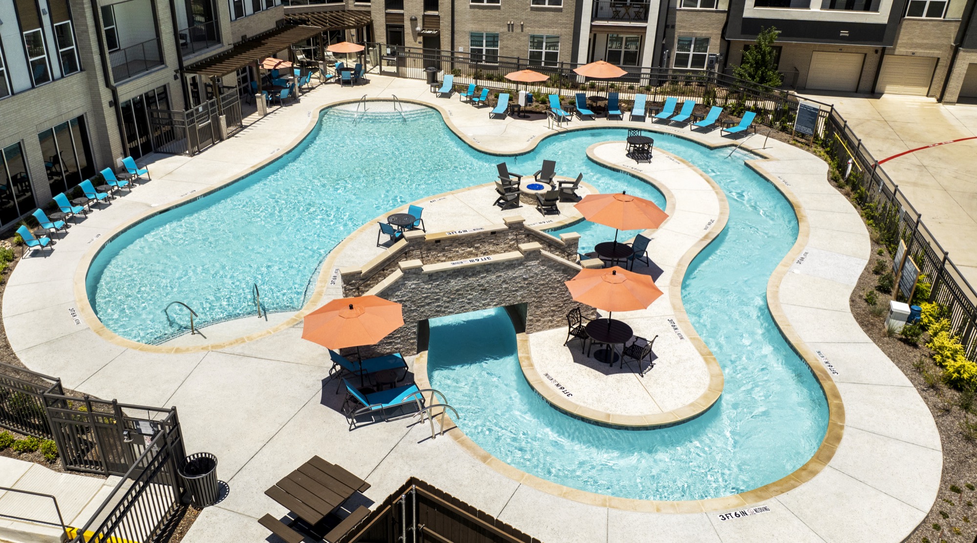 Daytime aerial view of The Duvall pool