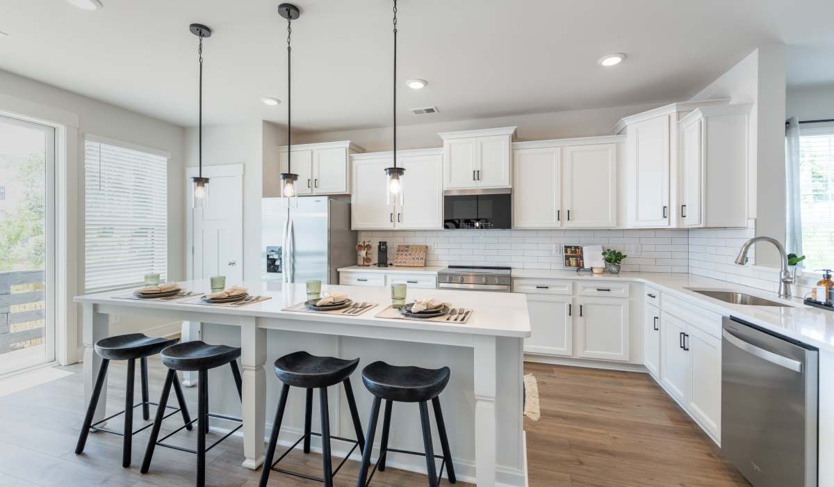 Open layout kitchen with dining table at Maybrook Terraces in Greenville, South Carolina