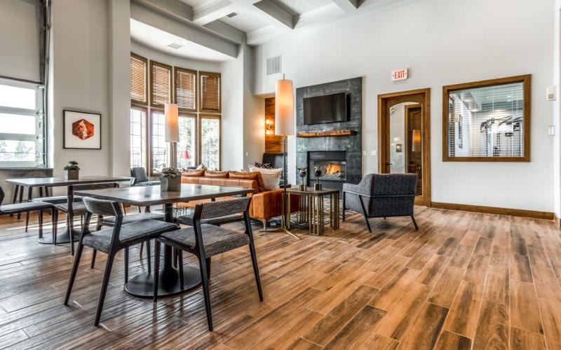 a clubroom with a table and chairs
