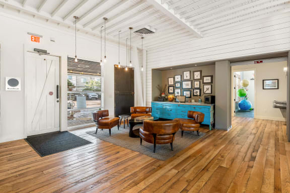 a living room with wood floors and a blue bar at Mullan Reserve Apartments, Montana, 59808