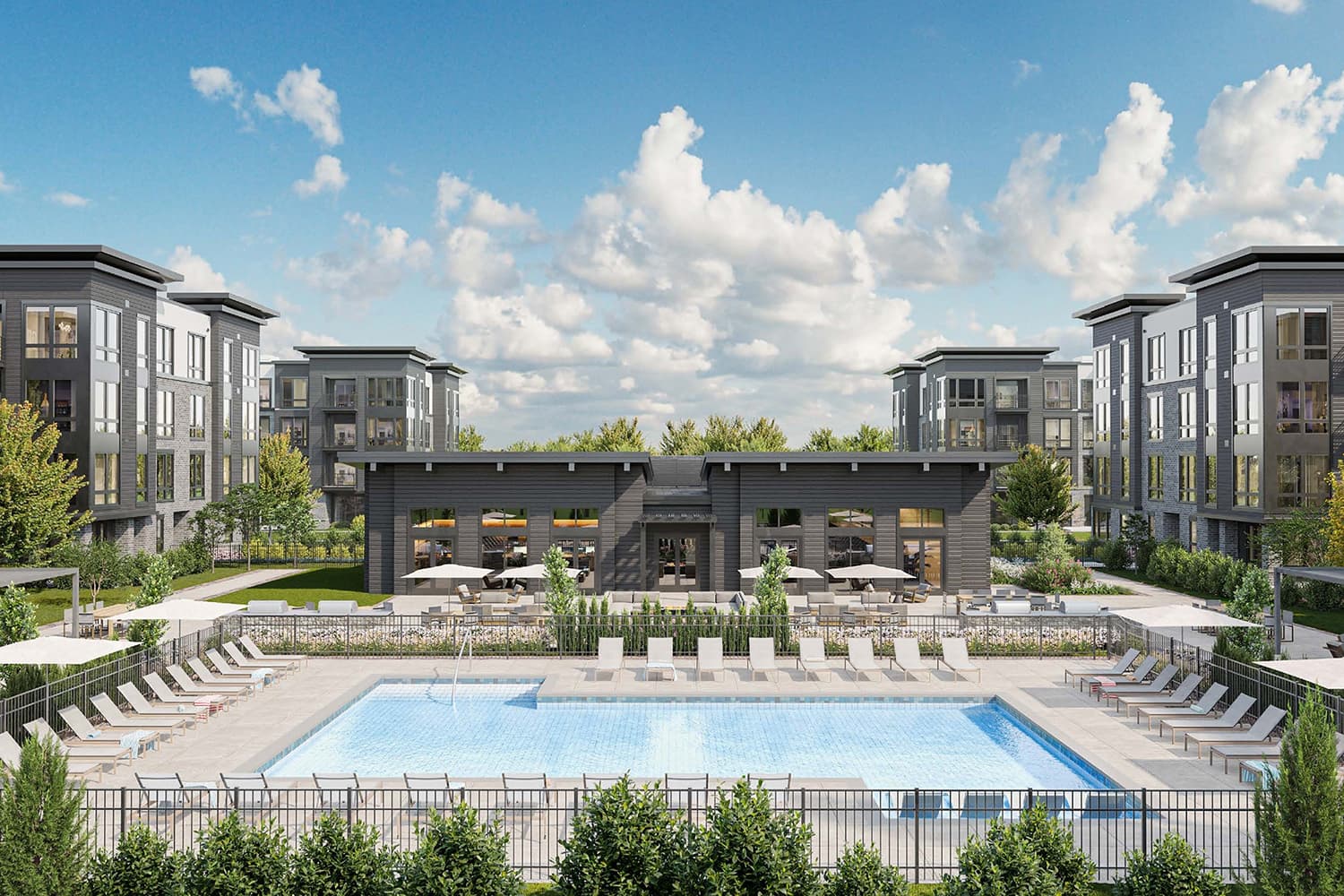 Resort-style pool surrounded by contemporary apartment buildings at Livana East Hanover in New Jersey