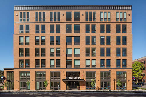 A large brick building with the word "Borealis" on the front.