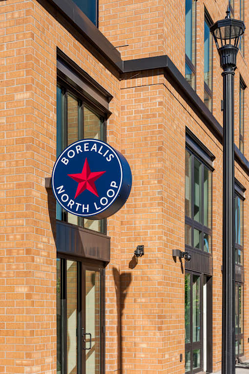 A sign on a building that says Borealis North Loo.