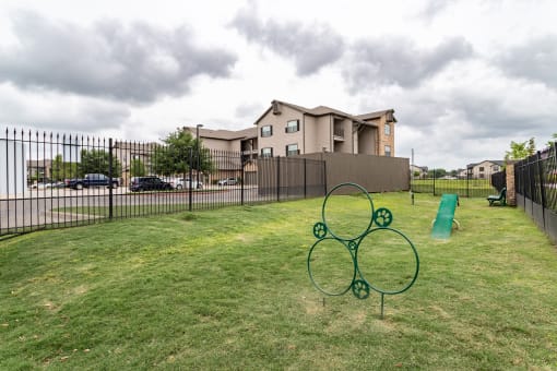 Dog park fenced in with obstacles