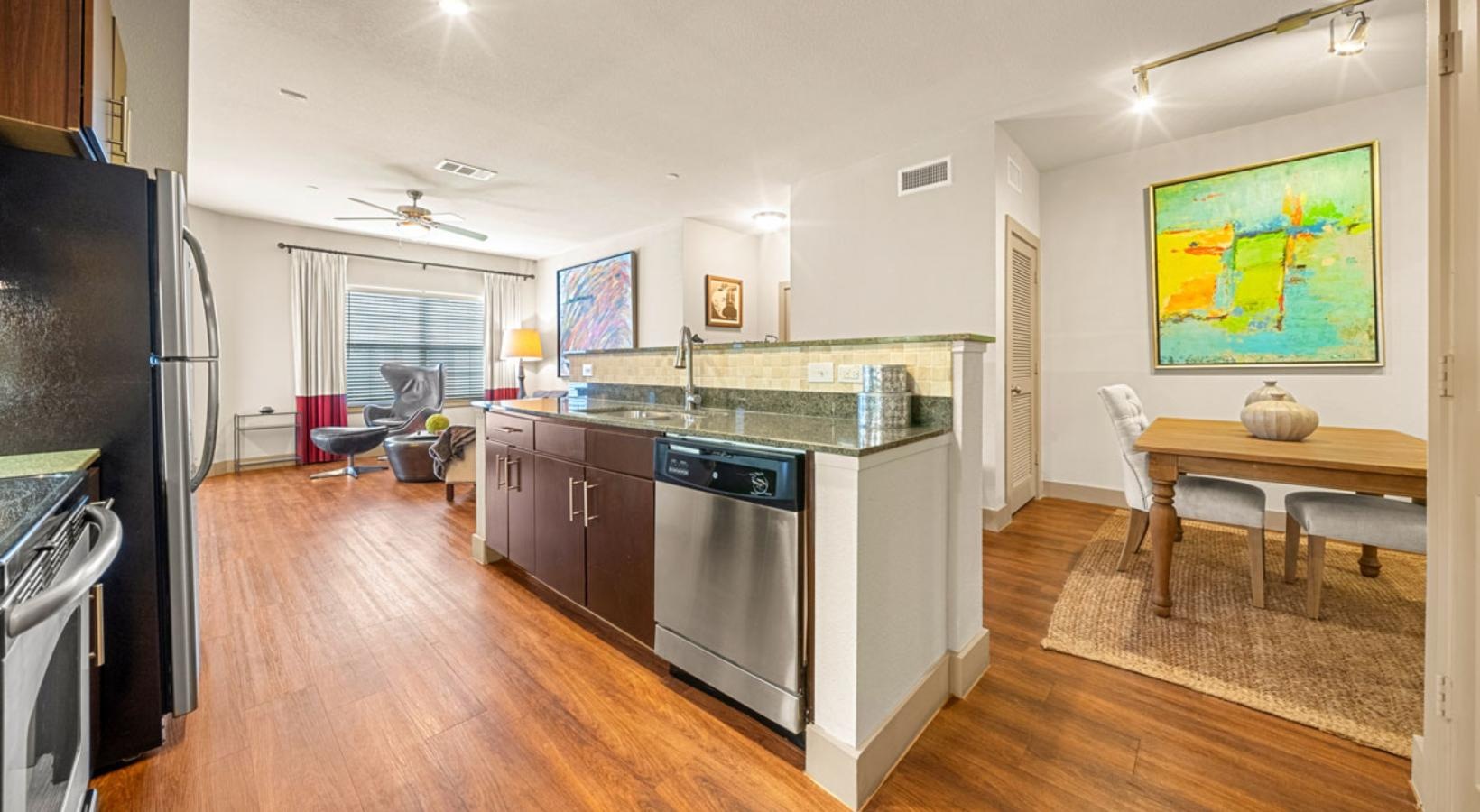 a kitchen with a table and chairs