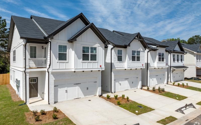 white houses with driveways
