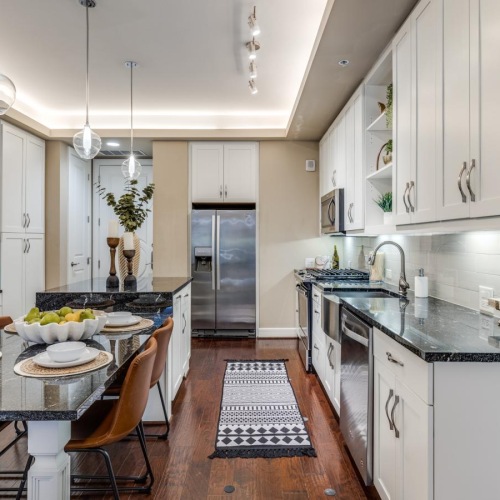 a kitchen with white cabinets