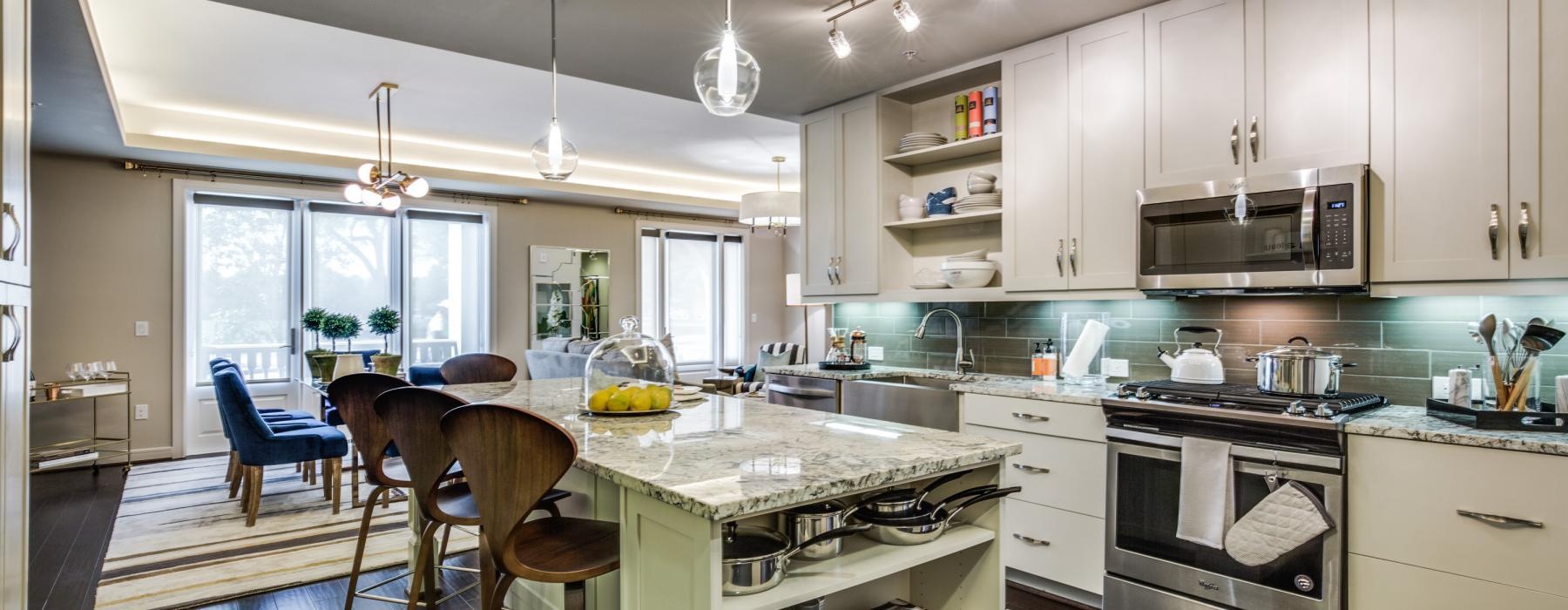 a kitchen with white cabinets
