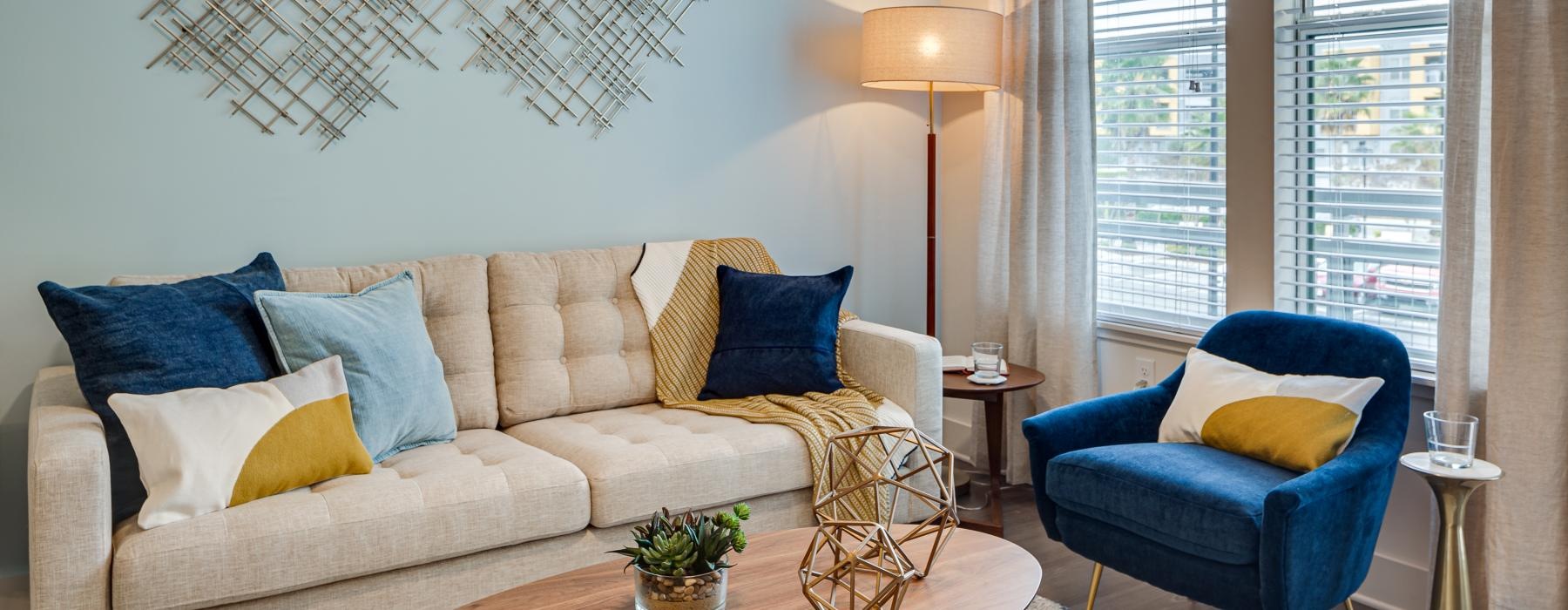 a living room with a couch and chairs