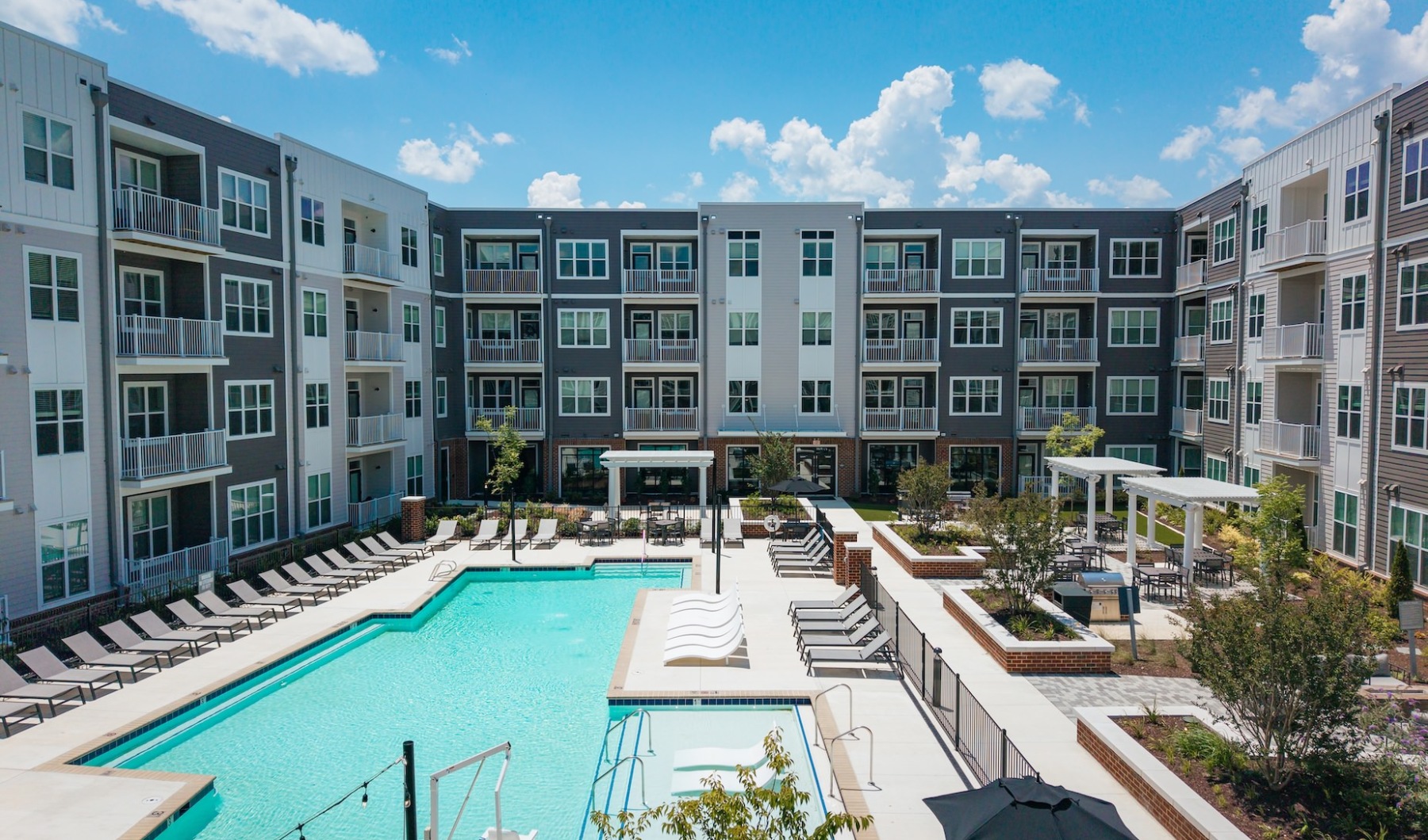 Resort-style swimming pool at Madison Ironbridge apartments in Chesterfield Virginia.
