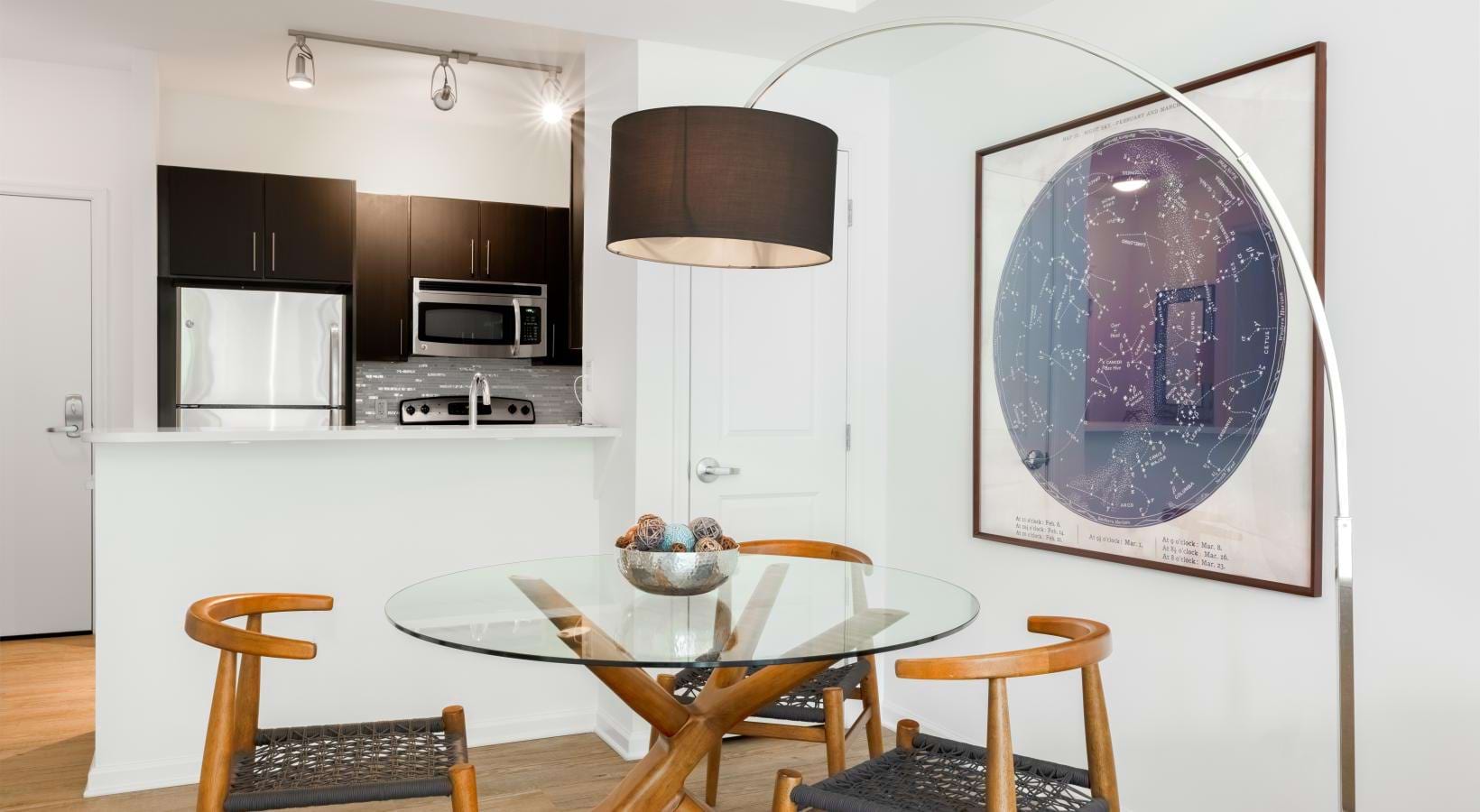 a kitchen with a table and chairs