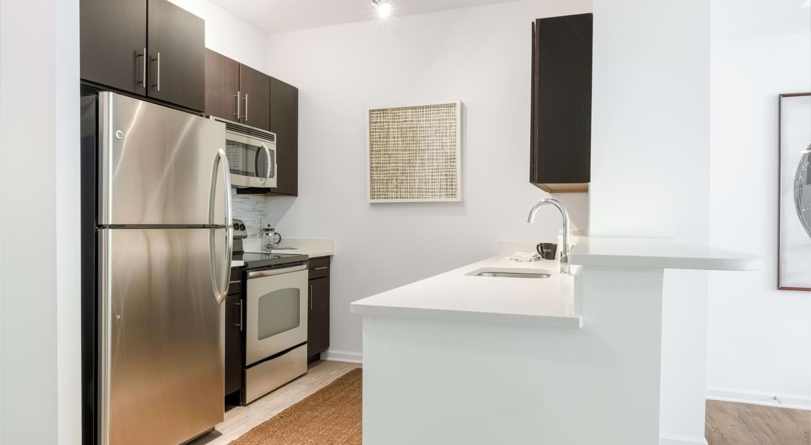 a kitchen with a refrigerator and stove