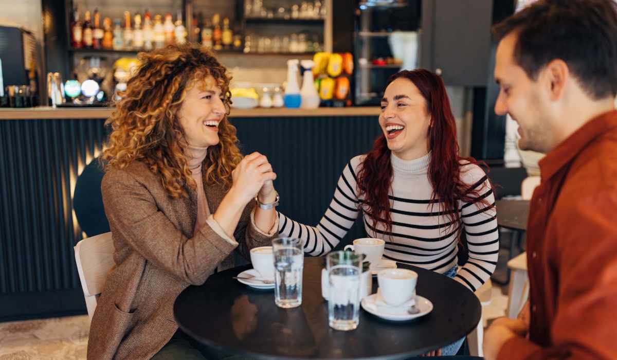 Friends drinking coffee near Centreport Lake in Fort Worth, Texas