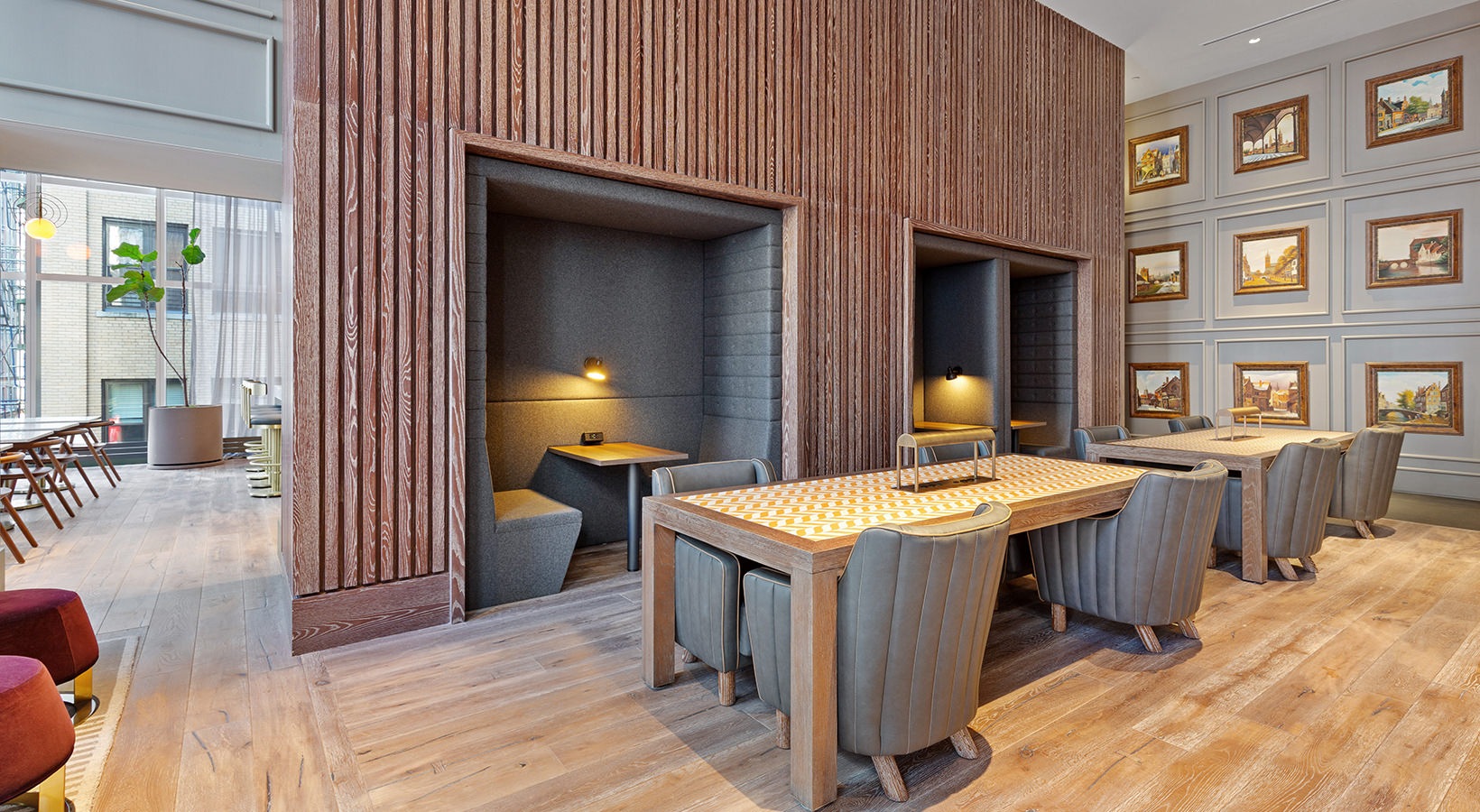 Coworking space at 19 Dutch with private work pods, lounge seating in a modern Lower Manhattan amenity space.