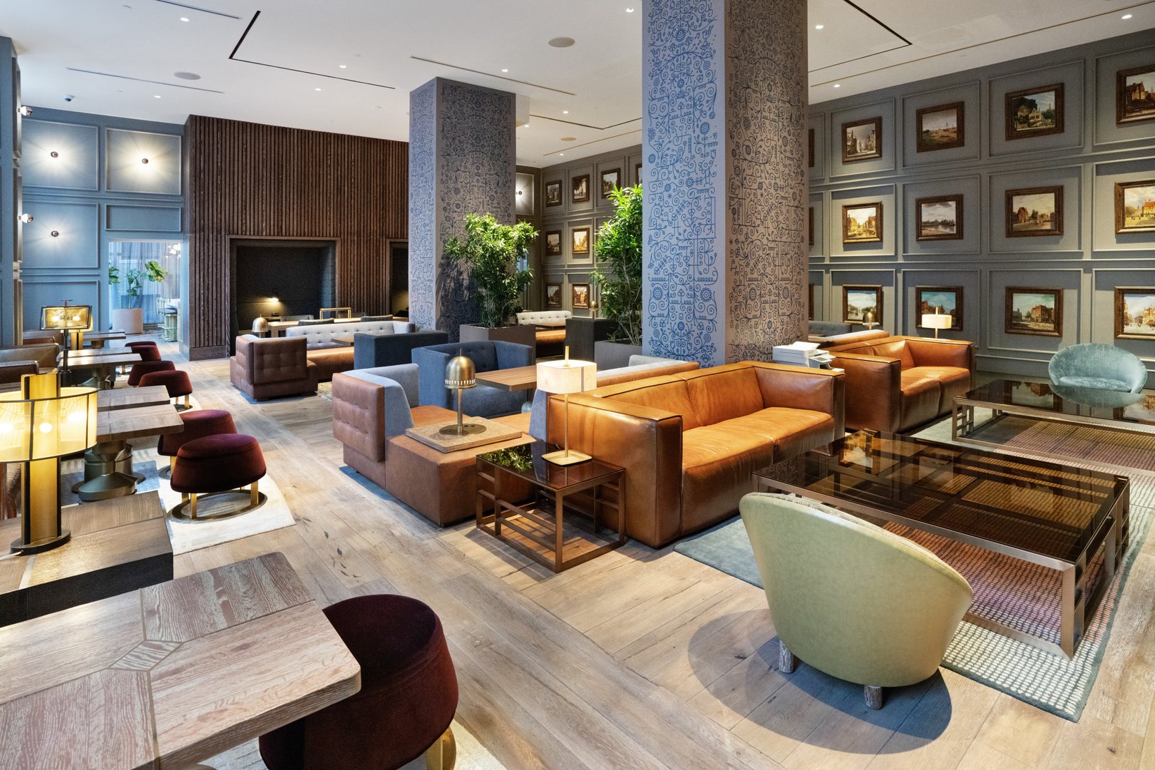 Spacious lounge at 19 Dutch with leather seating, art-filled walls, and modern décor in FiDi, Lower Manhattan.