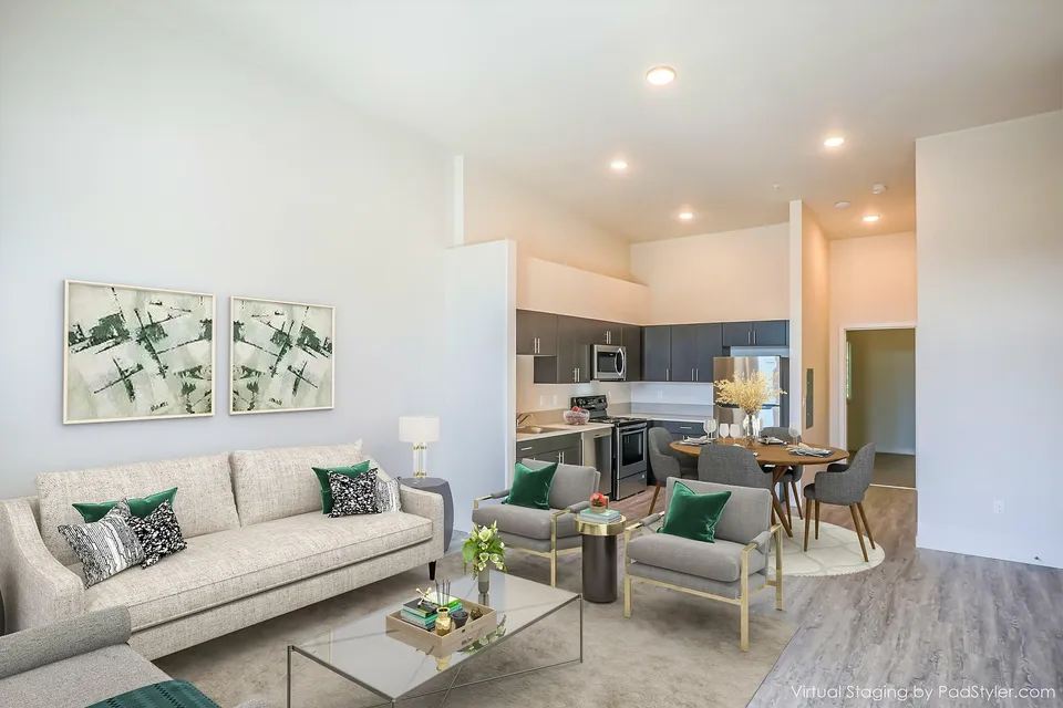 virtually staged living room with beige sofa and two grey chairs at rogers landing