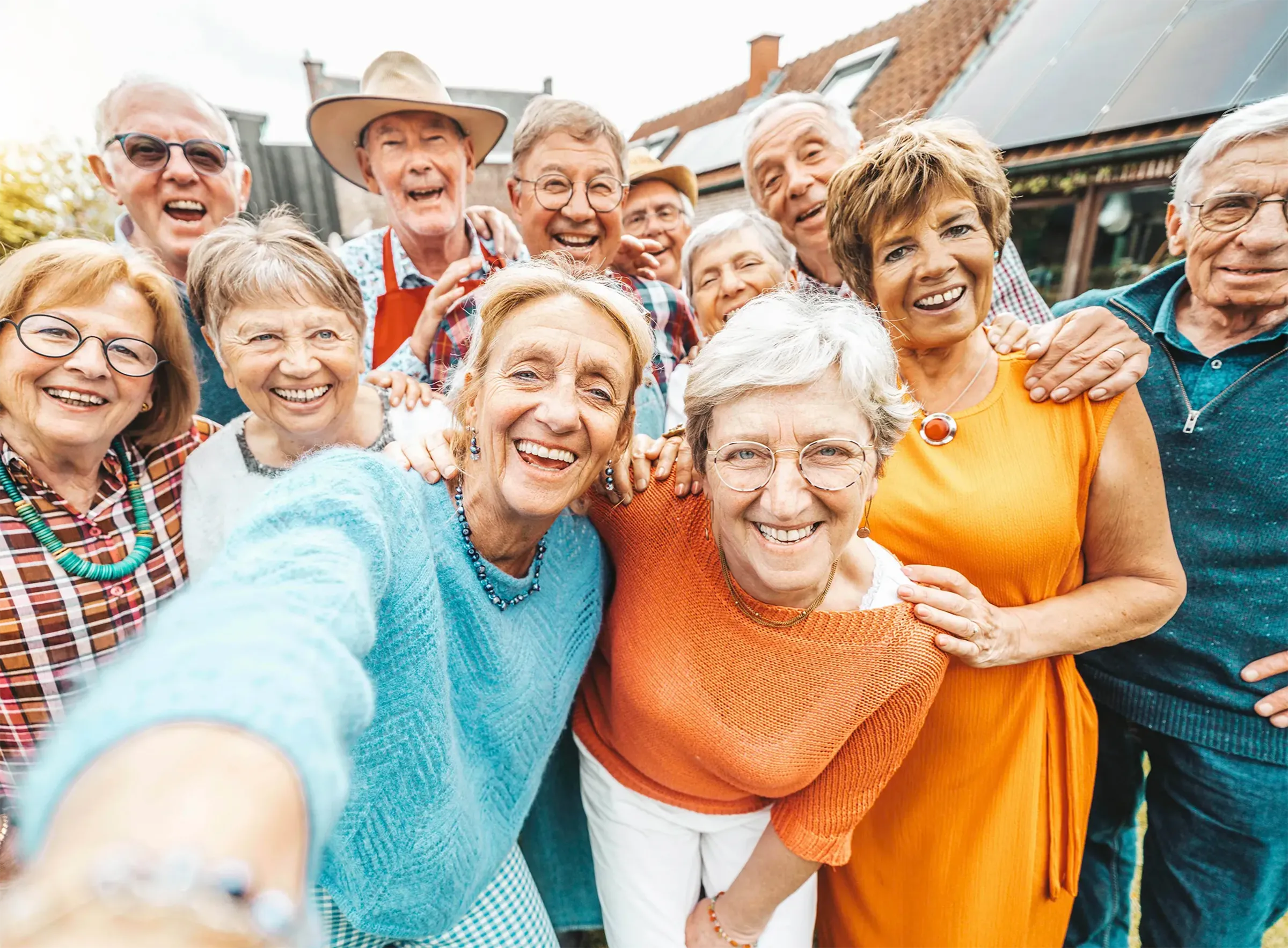 smiling group of seniors standing outside