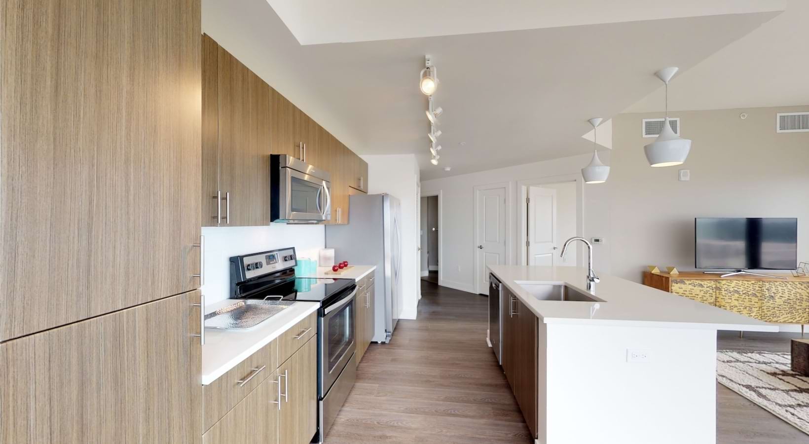 a kitchen with wood cabinets
